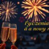 Fajerwerki i szampan na nowy rok z napisem Życzenia na nowy rok